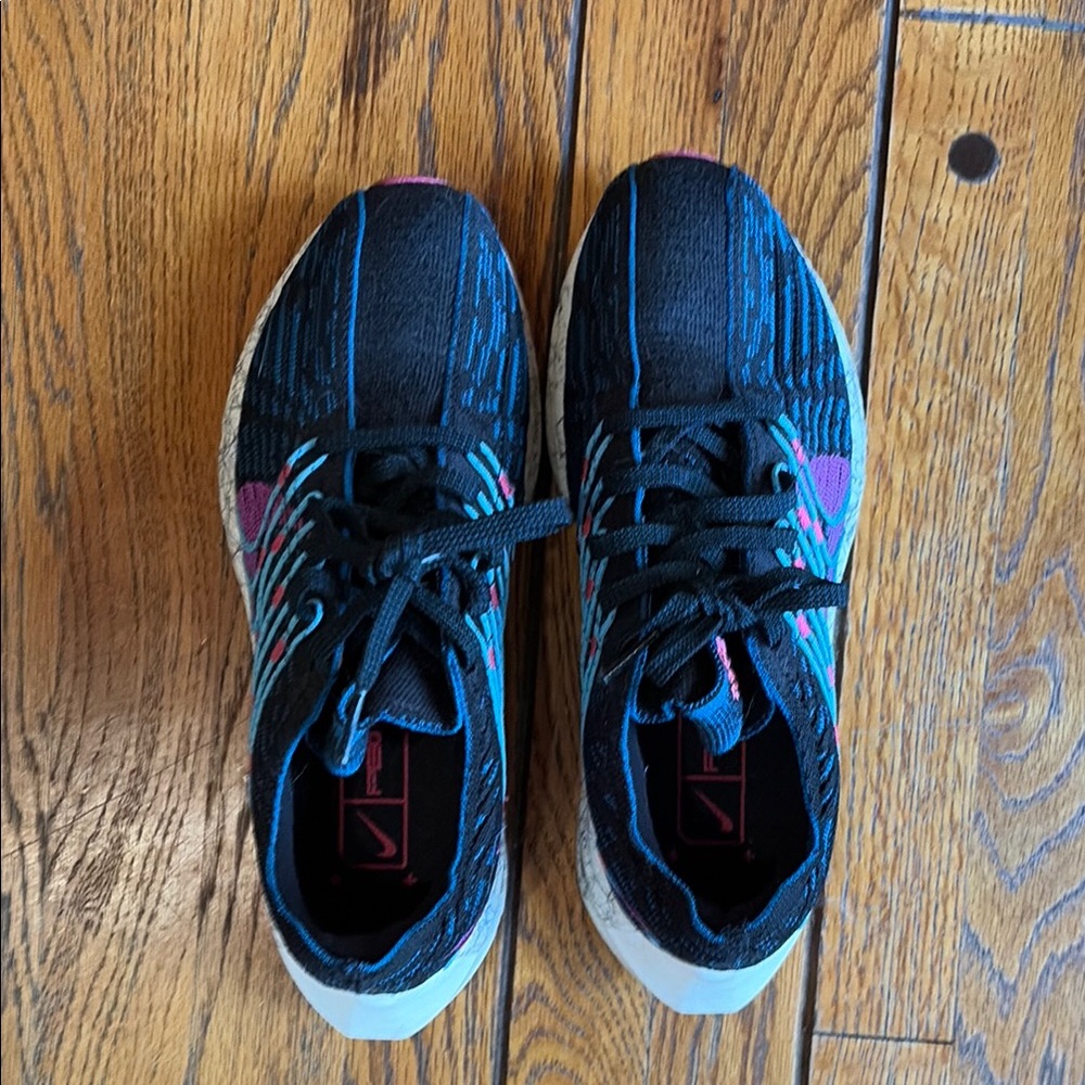 Nike Women's Black Running Shoes with Teal & Pink Details
